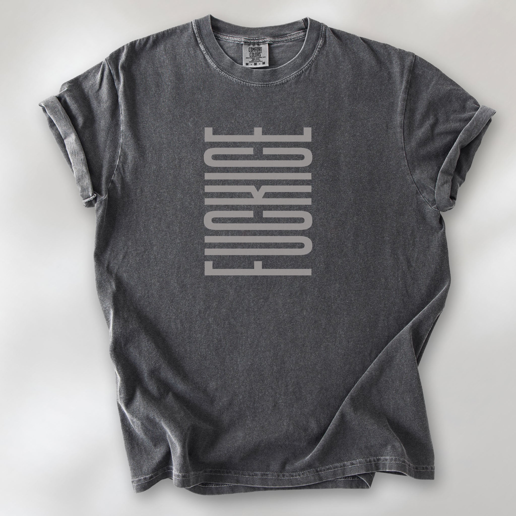Pepper t-shirt with minimalist geometric design that subtly spells “Fuck ICE” using stacked bars and negative space, hidden protest message shirt.