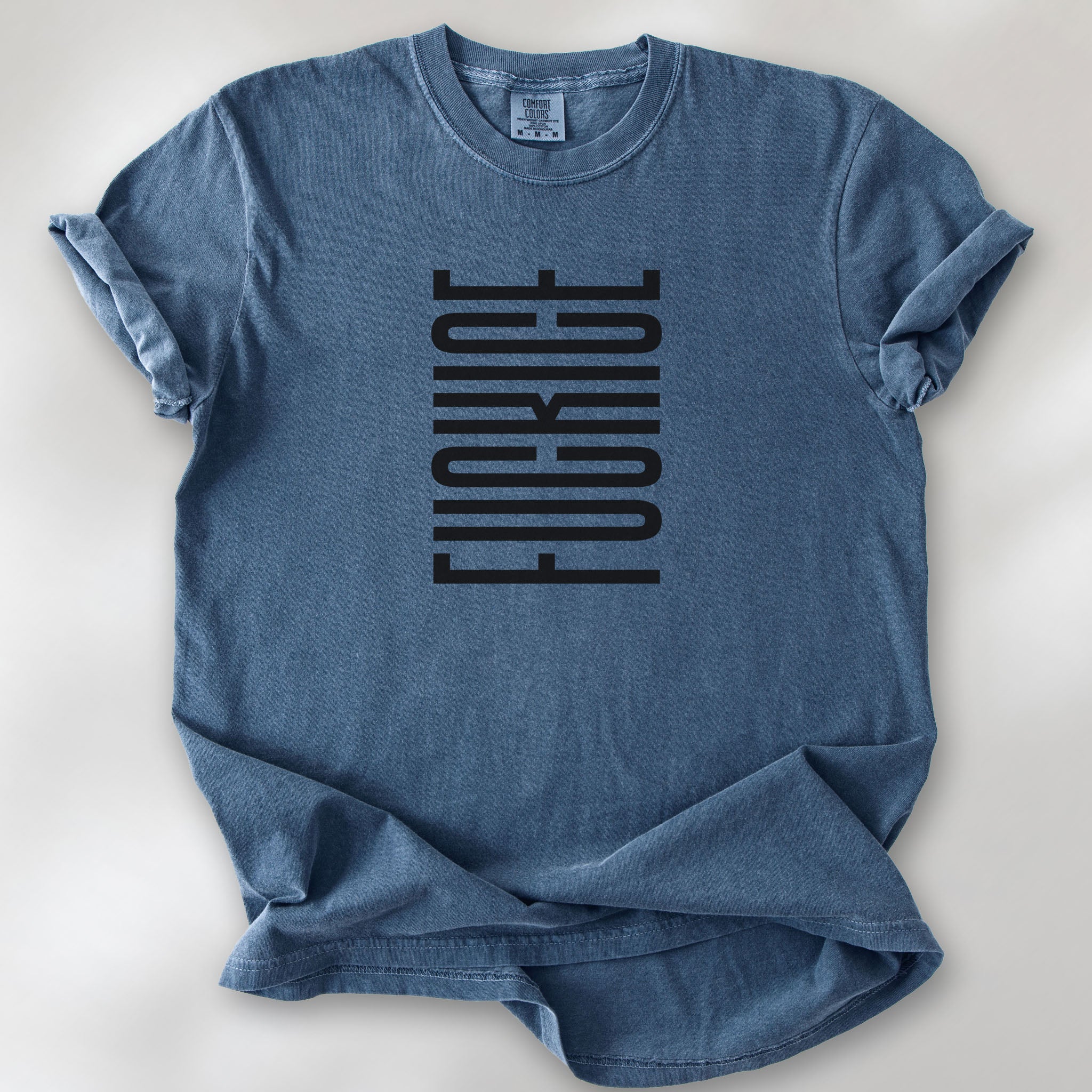 Denim t-shirt with minimalist black geometric design that subtly spells “Fuck ICE” using stacked bars and negative space, hidden protest message shirt.
