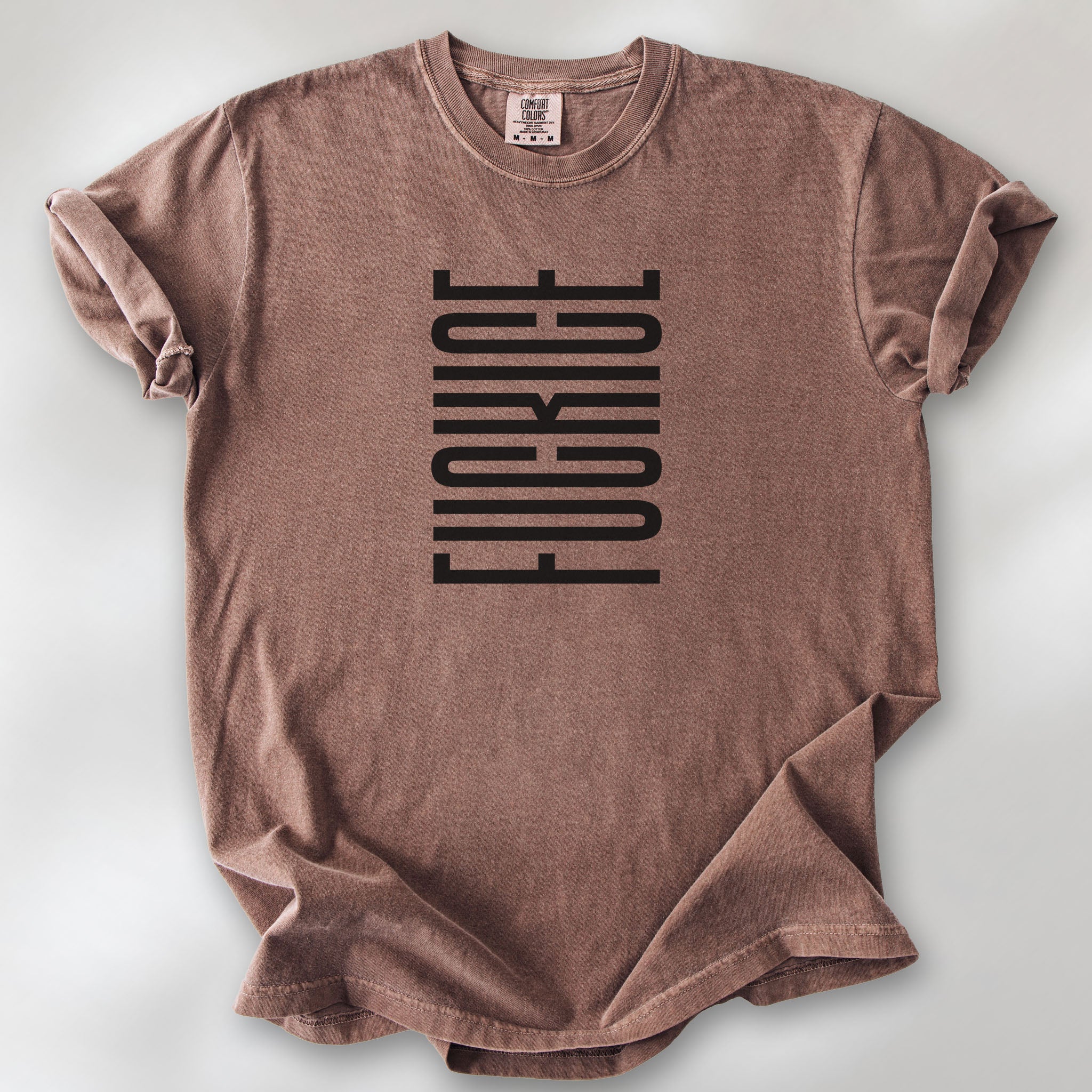 Espresso t-shirt with minimalist black geometric design that subtly spells “Fuck ICE” using stacked bars and negative space, hidden protest message shirt.