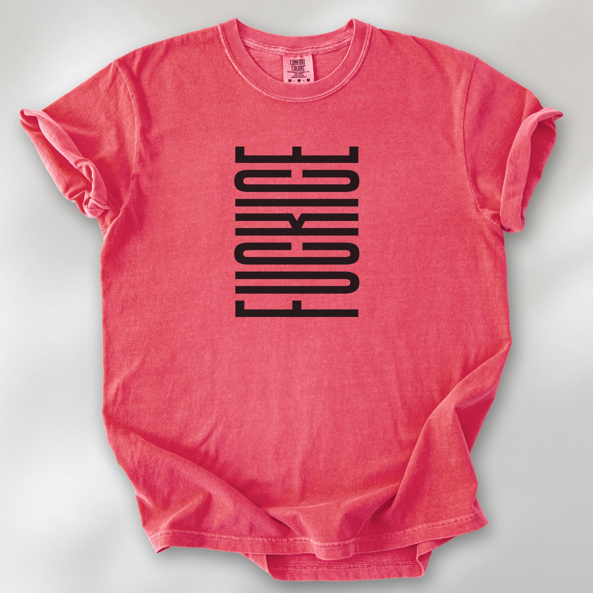Watermelon t-shirt with minimalist black geometric design that subtly spells “Fuck ICE” using stacked bars and negative space, hidden protest message shirt.