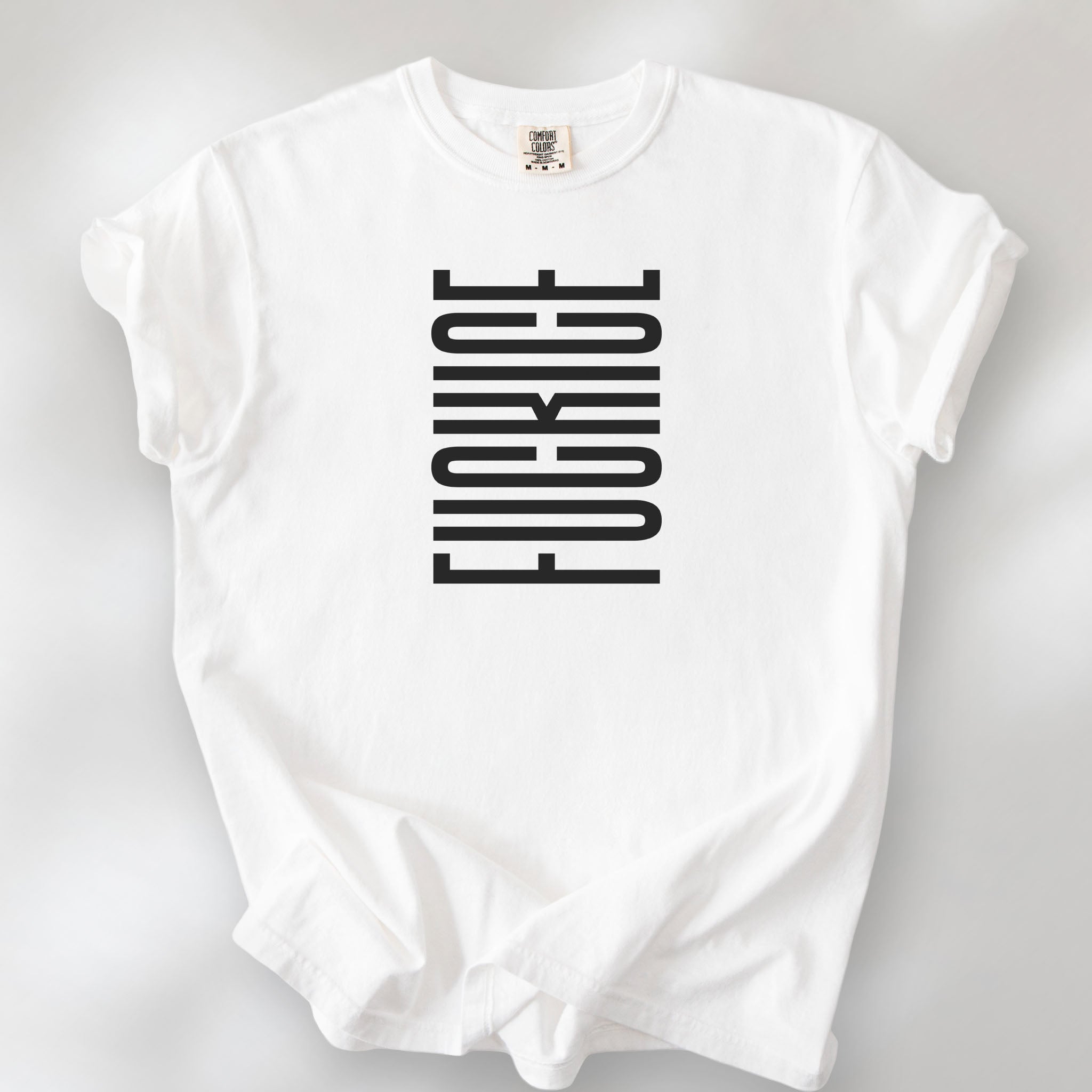 White t-shirt with minimalist black geometric design that subtly spells “Fuck ICE” using stacked bars and negative space, hidden protest message shirt.