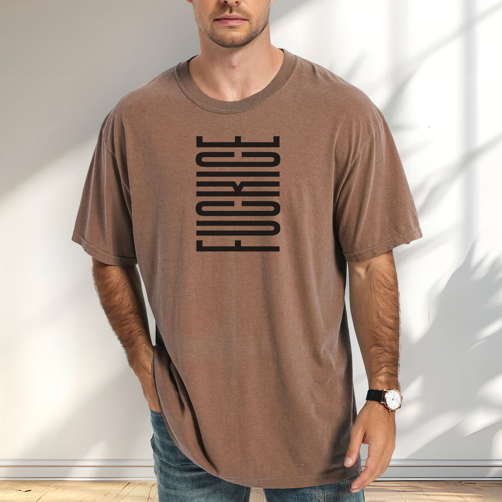 Male model wearing espresso t-shirt with minimalist black geometric design that subtly spells “Fuck ICE” using stacked bars and negative space, hidden protest message shirt.