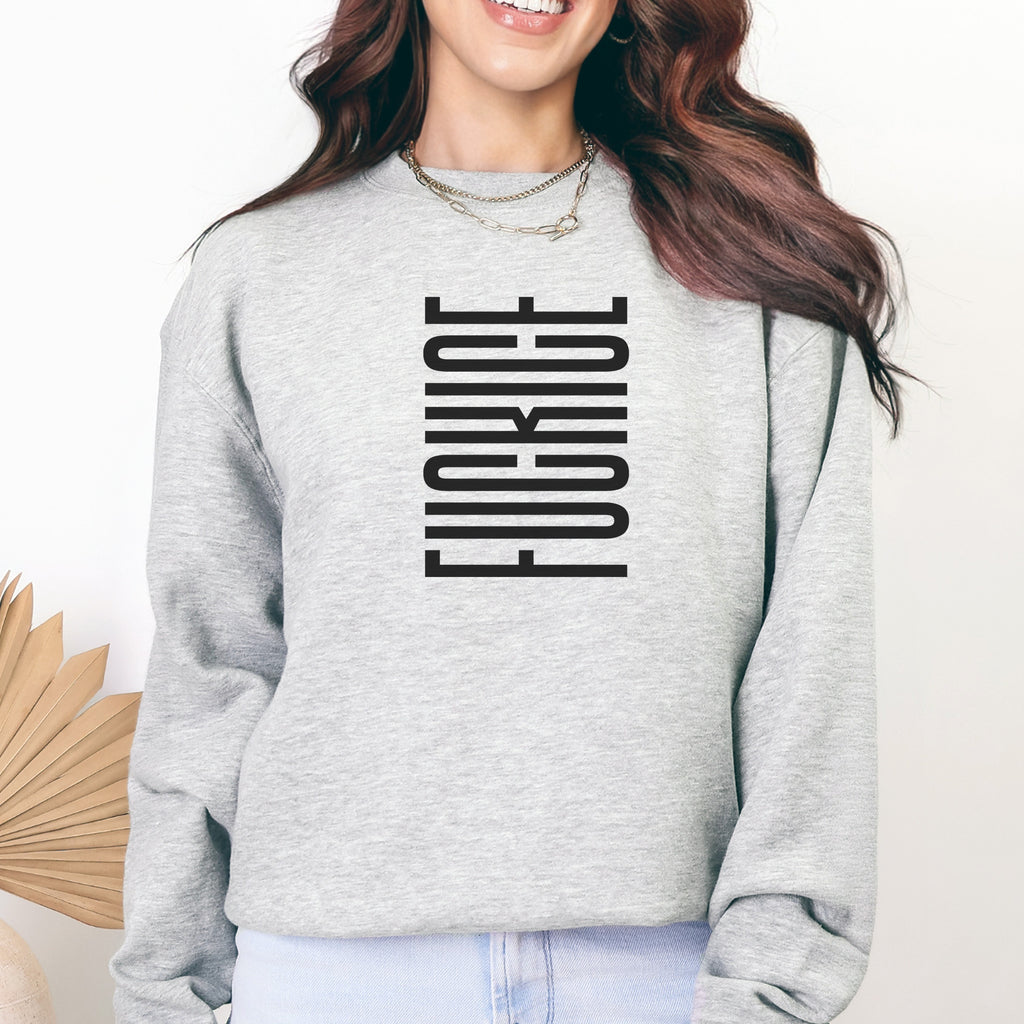 Female model wearing grey sweatshirt with minimalist black geometric design that subtly spells “Fuck ICE” using stacked bars and negative space, hidden protest message shirt.