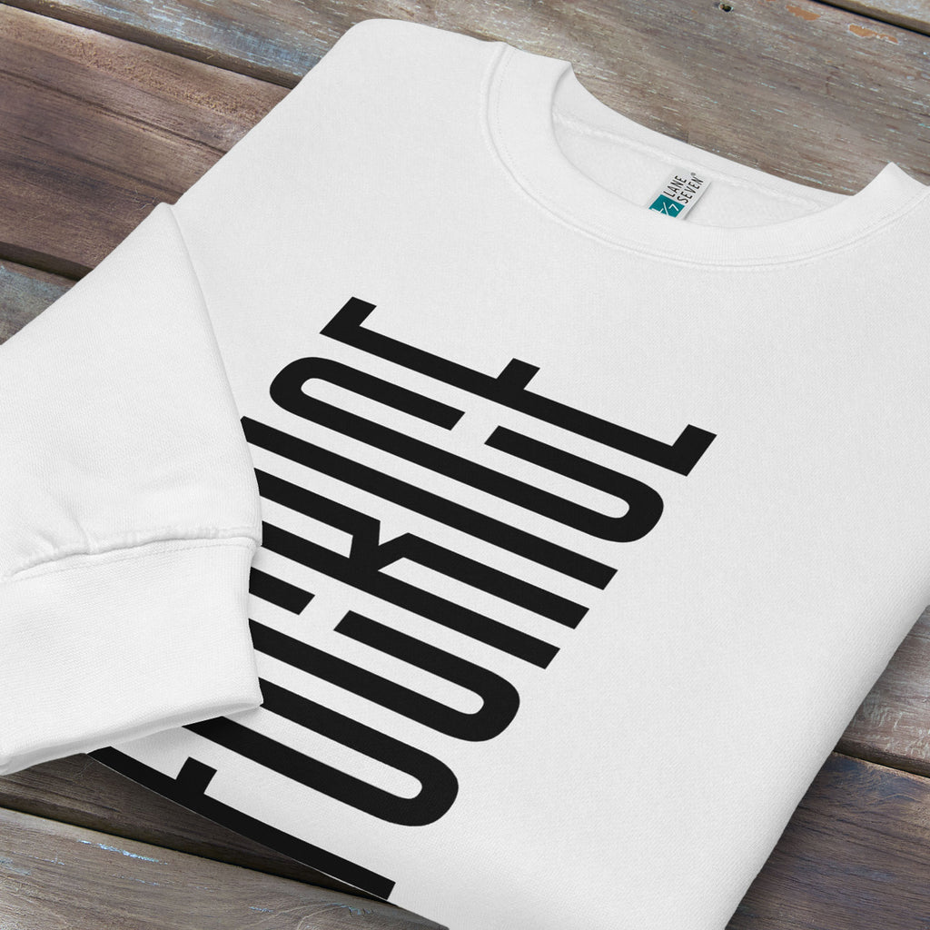Folded white sweatshirt with minimalist black geometric design that subtly spells “Fuck ICE” using stacked bars and negative space, hidden protest message shirt.