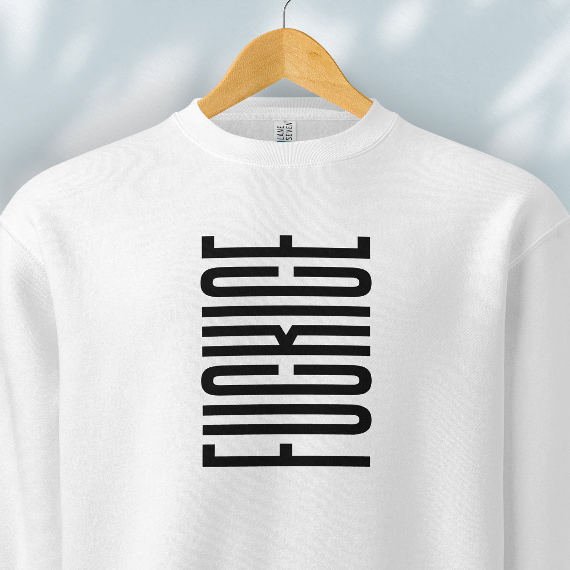 Hanging white sweatshirt with minimalist black geometric design that subtly spells “Fuck ICE” using stacked bars and negative space, hidden protest message shirt.
