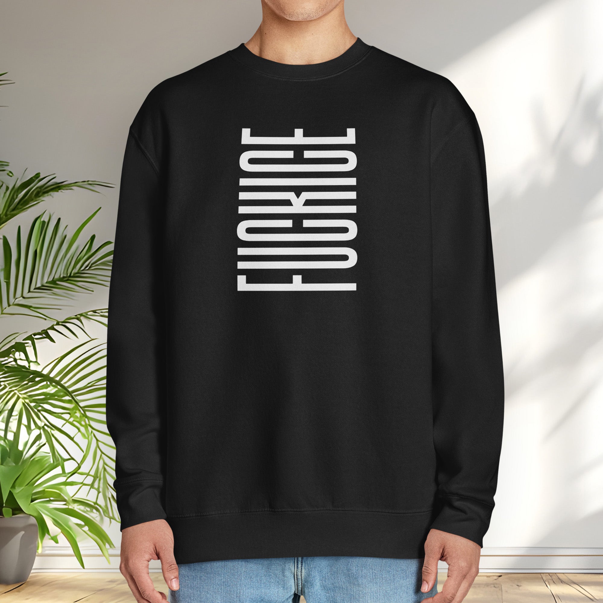 Male model wearing black sweatshirt with minimalist black geometric design that subtly spells “Fuck ICE” using stacked bars and negative space, hidden protest message shirt.