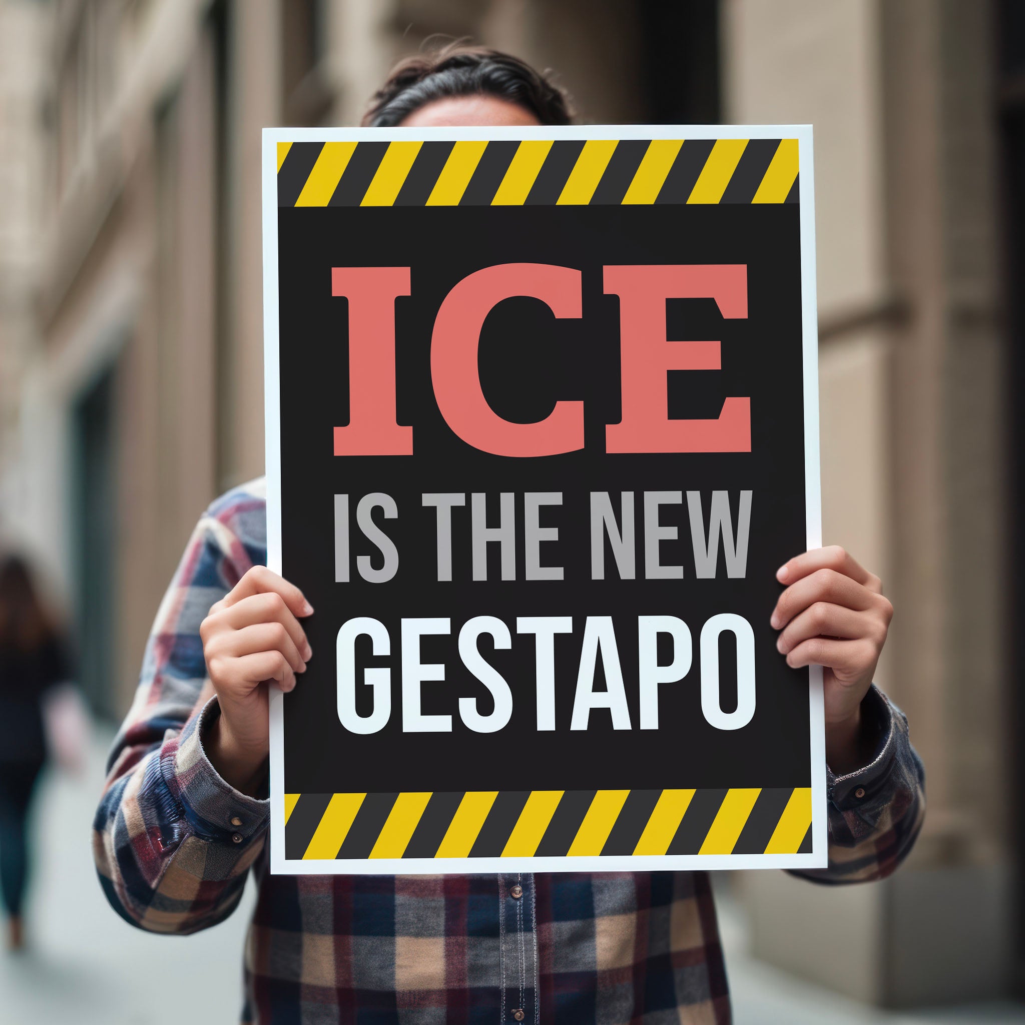 Person holding protest sign that reads "ICE is the new gestapo" in strong bold red, grey, and white text on a black background with yellow warning stripes at the top and bottom.