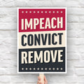 Protest sign reading “Impeach Convict Remove” in bold patriotic lettering.