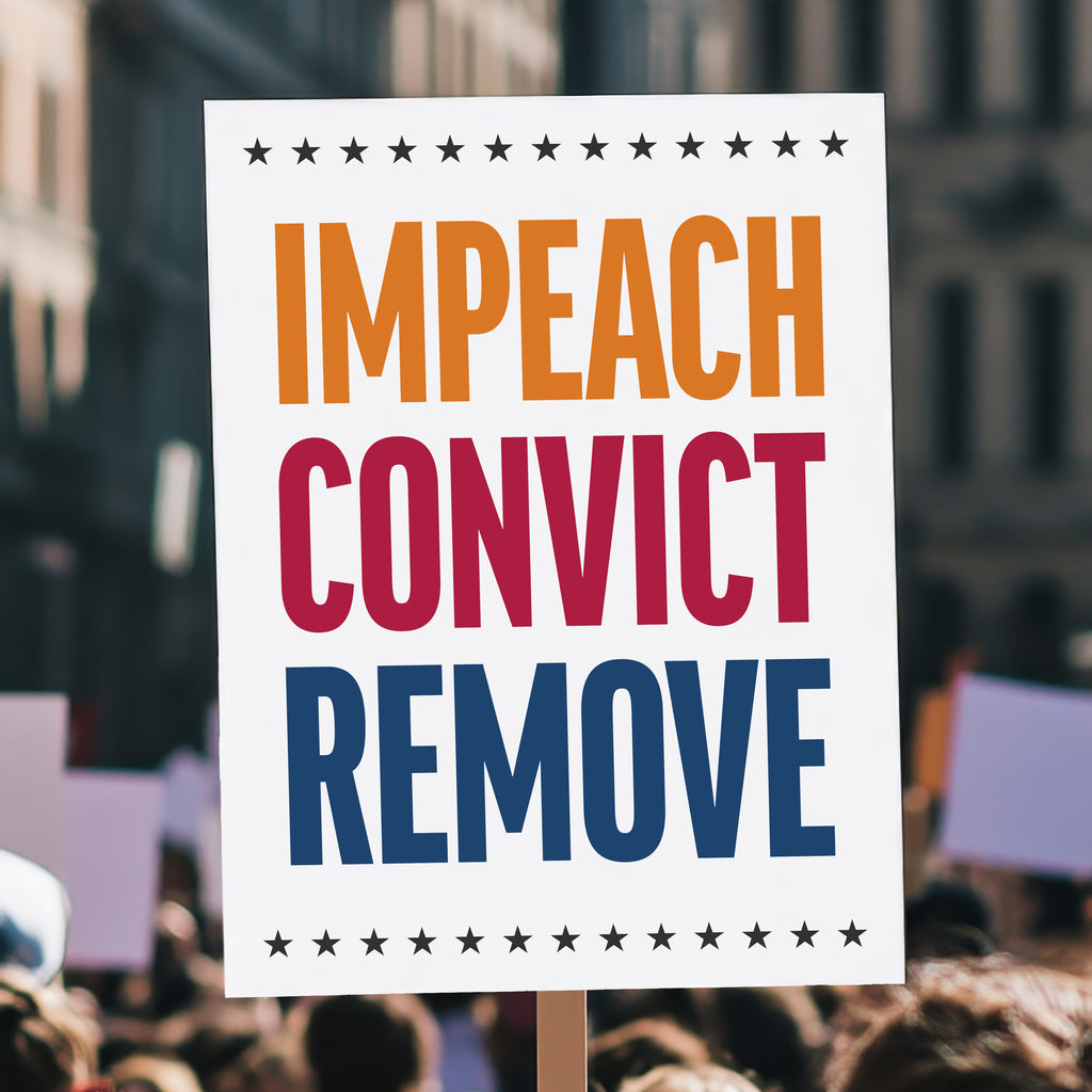 Anti-Trump protest sign reading “Impeach Convict Remove” in bold red, blue, and orange text with stars, held high above a crowd.