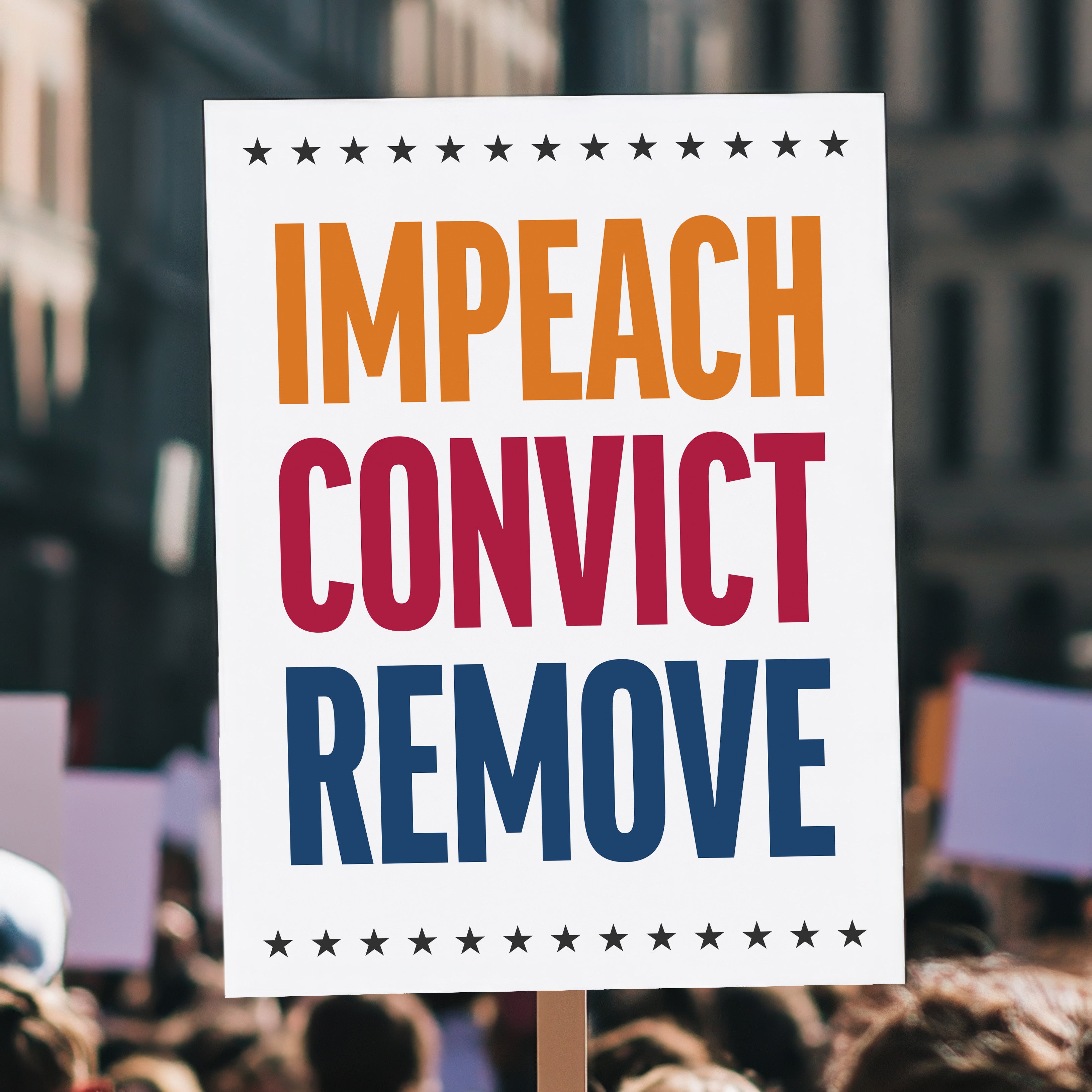 Anti-Trump protest sign reading “Impeach Convict Remove” in bold red, blue, and orange text with stars, held high above a crowd.