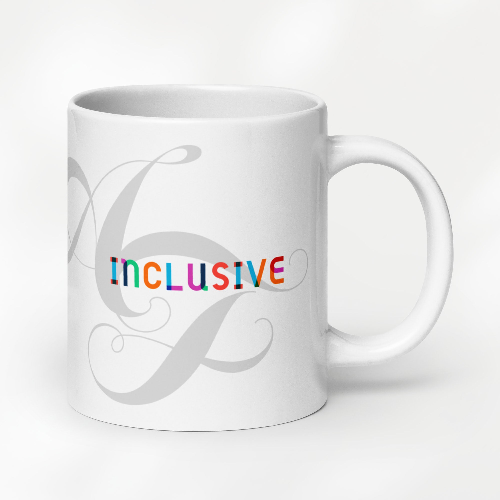 20 ounce white ceramic mug with the word “Inclusive” in colorful Gilbert font and faint script letters A and F behind it.