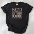 Black t-shirt with bold text reading “Injustice anywhere is a threat to justice everywhere” quote from Martin Luther King Jr, MLK Jr, Letters from Birmingham jail — civil rights protest apparel for activists.