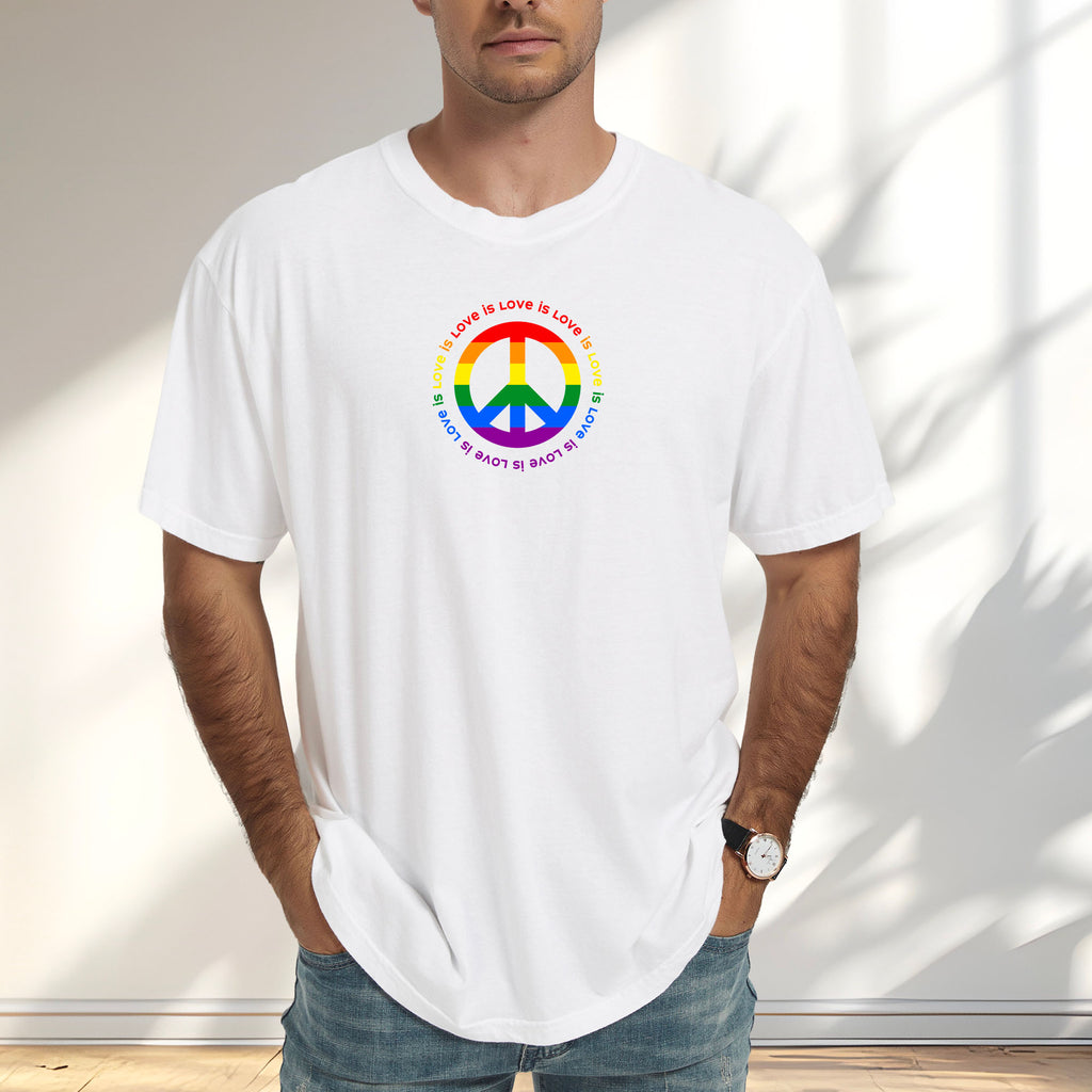 Male model wearing white t-shirt with LGBTQ pride graphic — a peace sign in the LGBTQ flag colors, with the text "love is love" repeated in a circle around the peace sign.