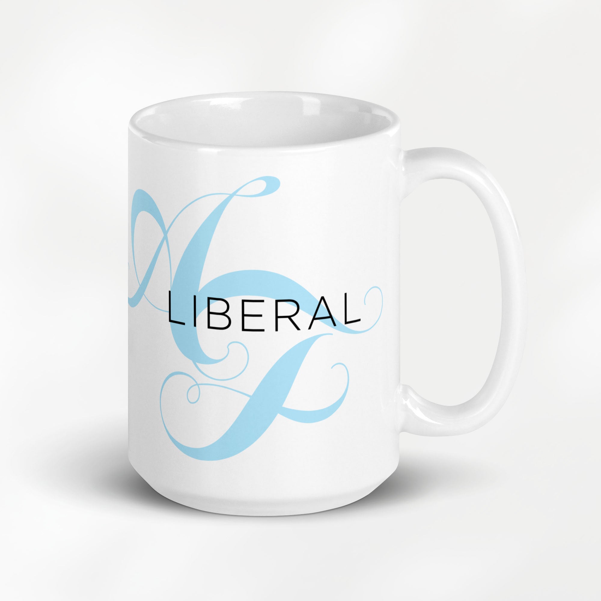 15 ounce white ceramic mug with the word “Liberal” in black text and a subtle light bright blue script design of the letters A and F in the background.