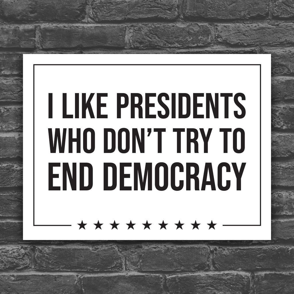 Black and white version of protest sign with text that reads "I like presidents who don't try to end democracy."