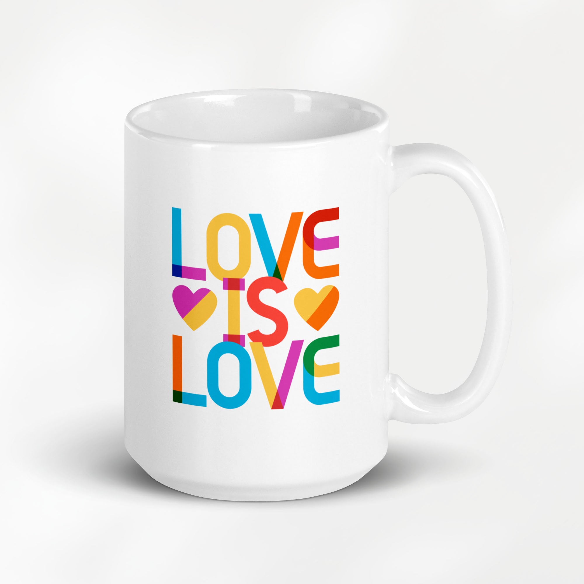 15 ounce white ceramic coffee mug with rainbow “love is love” text in a block design.