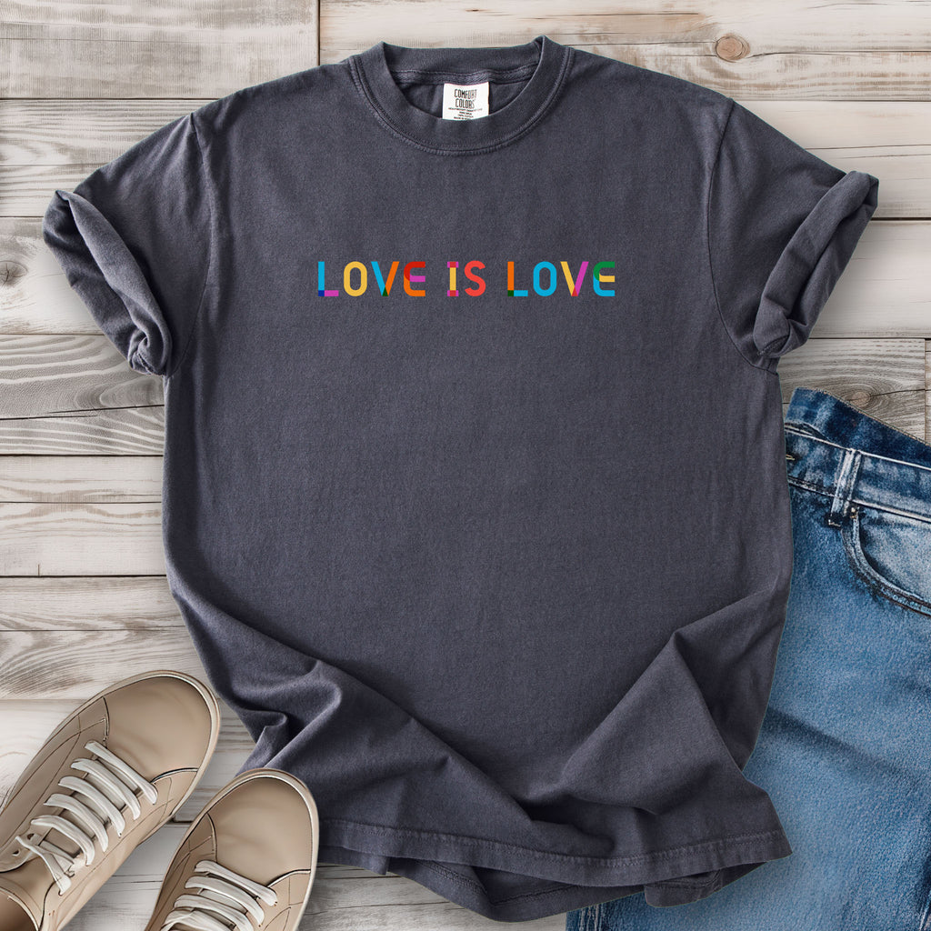 Graphite grey t-shirt with rainbow “love is love” text designed in the Gilbert font.