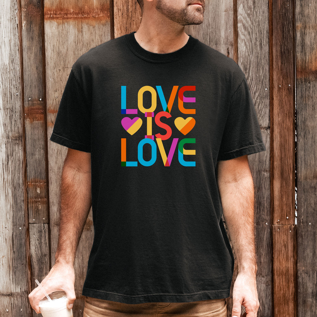 Male model wearing black t-shirt with rainbow “love is love” text designed in the Gilbert font.