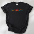 Black oversized t-shirt with rainbow “love is love” text in a single line.