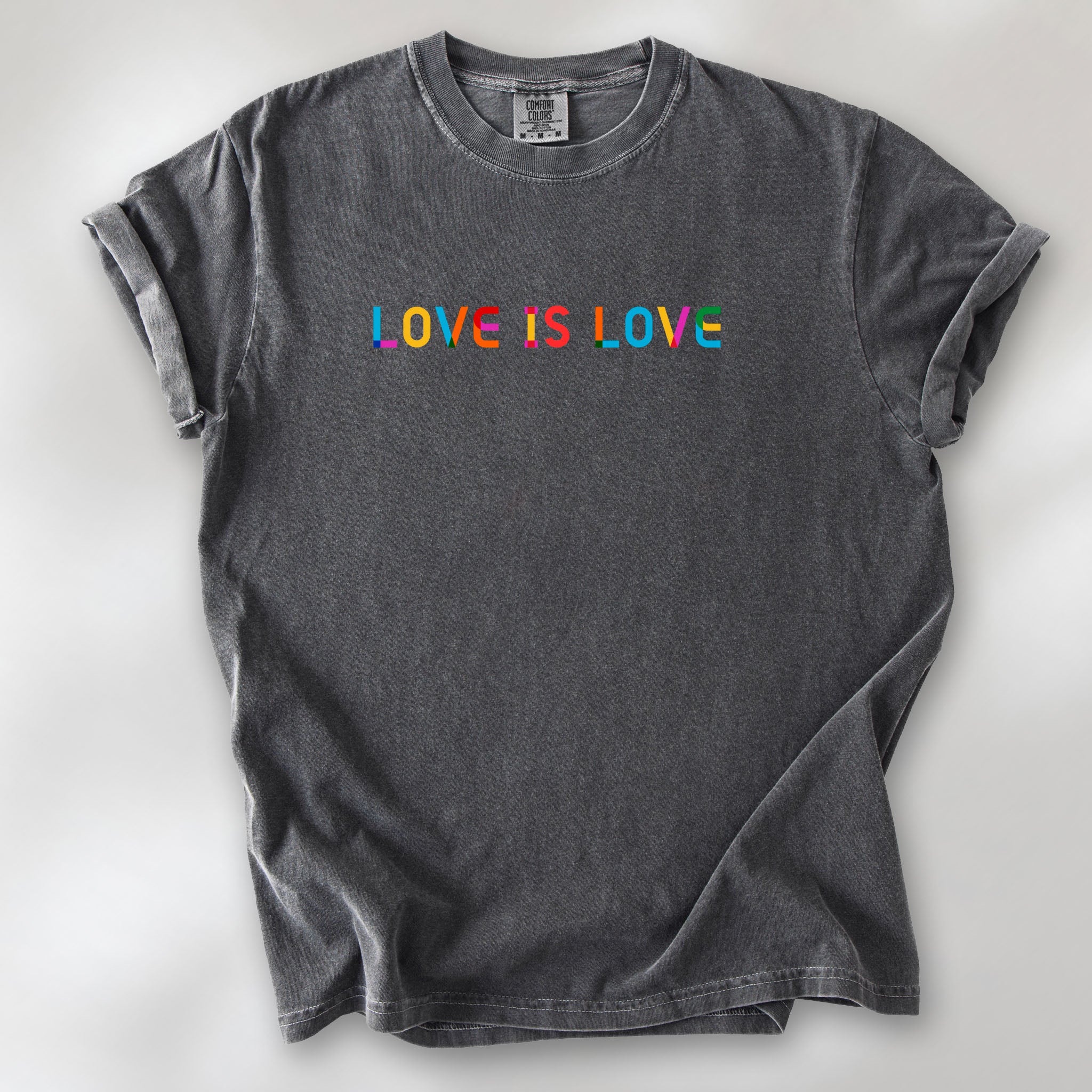 Pepper oversized t-shirt with rainbow “love is love” text in a single line.