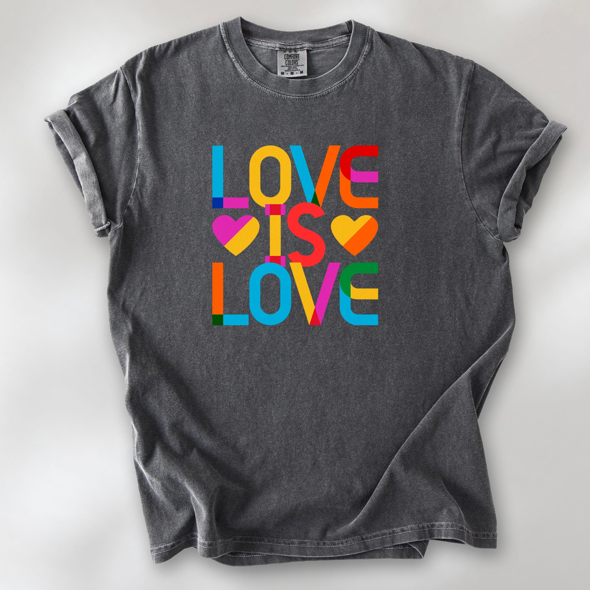 Pepper t-shirt with rainbow “love is love” text block.