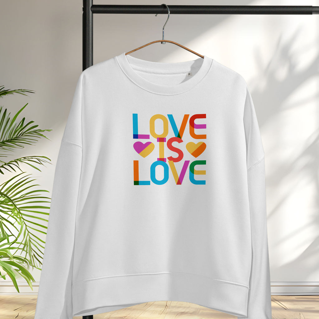 Hanging white women's sweatshirt with rainbow “love is love” text designed in the Gilbert font.