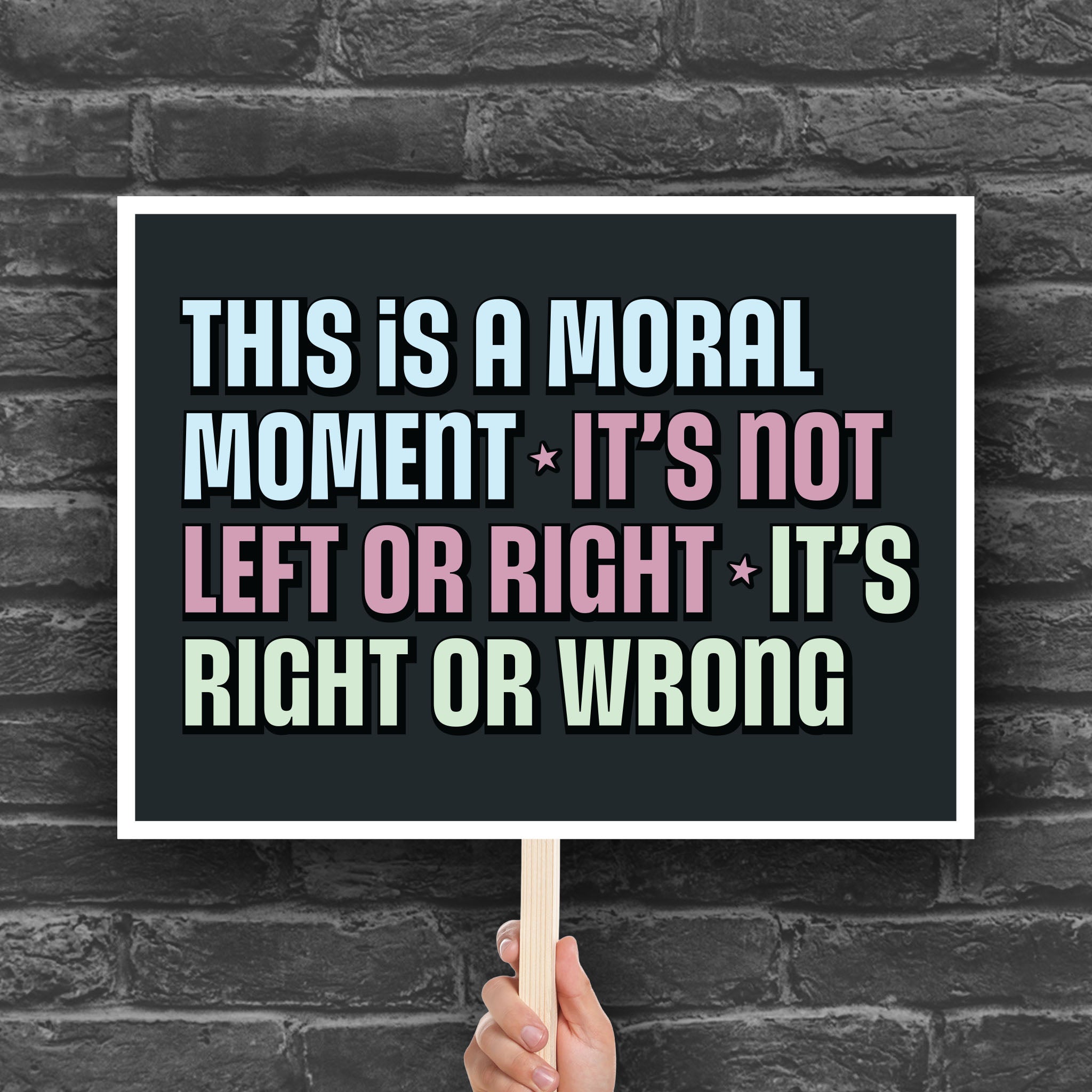 Downloadable, printable protest sign with bold colorful text: “This is a Moral Moment – It's Not Left or Right – It's Right or Wrong,” designed for political rallies, justice marches, and unapologetic resistance.