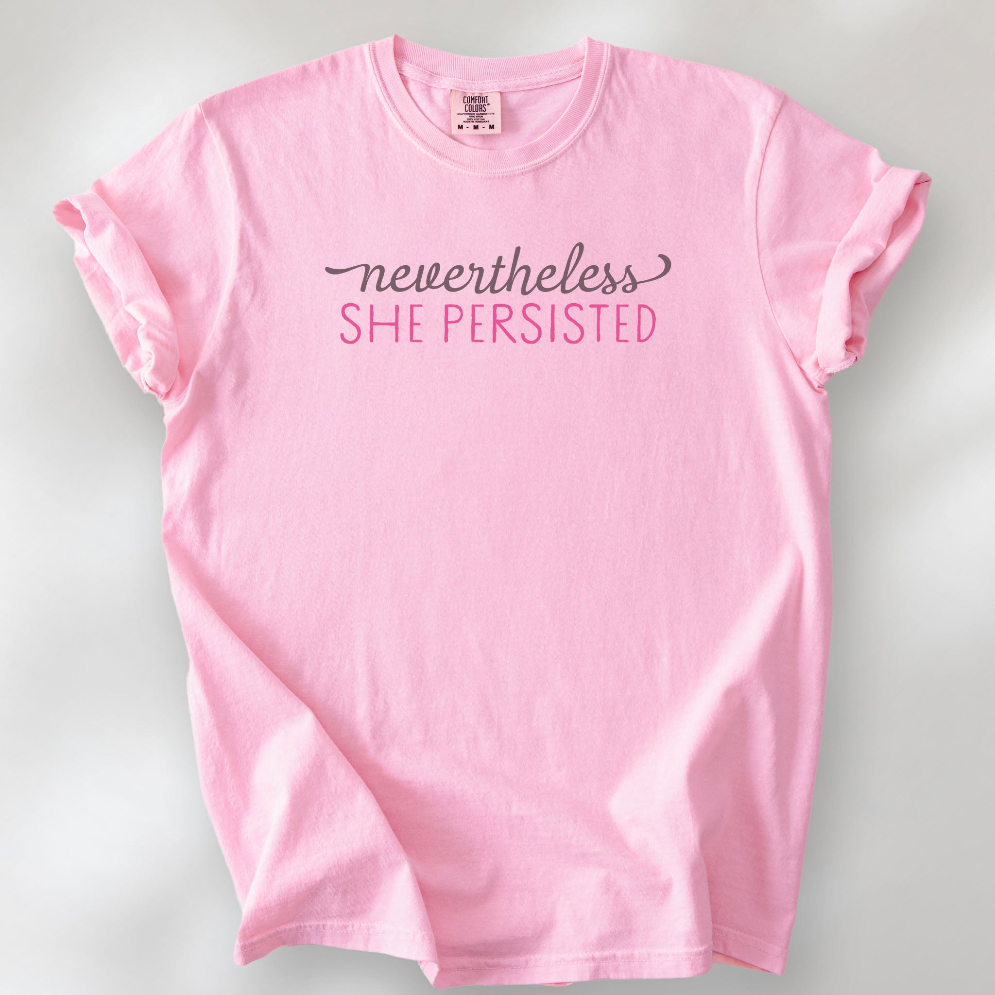 Blossom t-shirt with stylized text that reads "nevertheless she persisted."