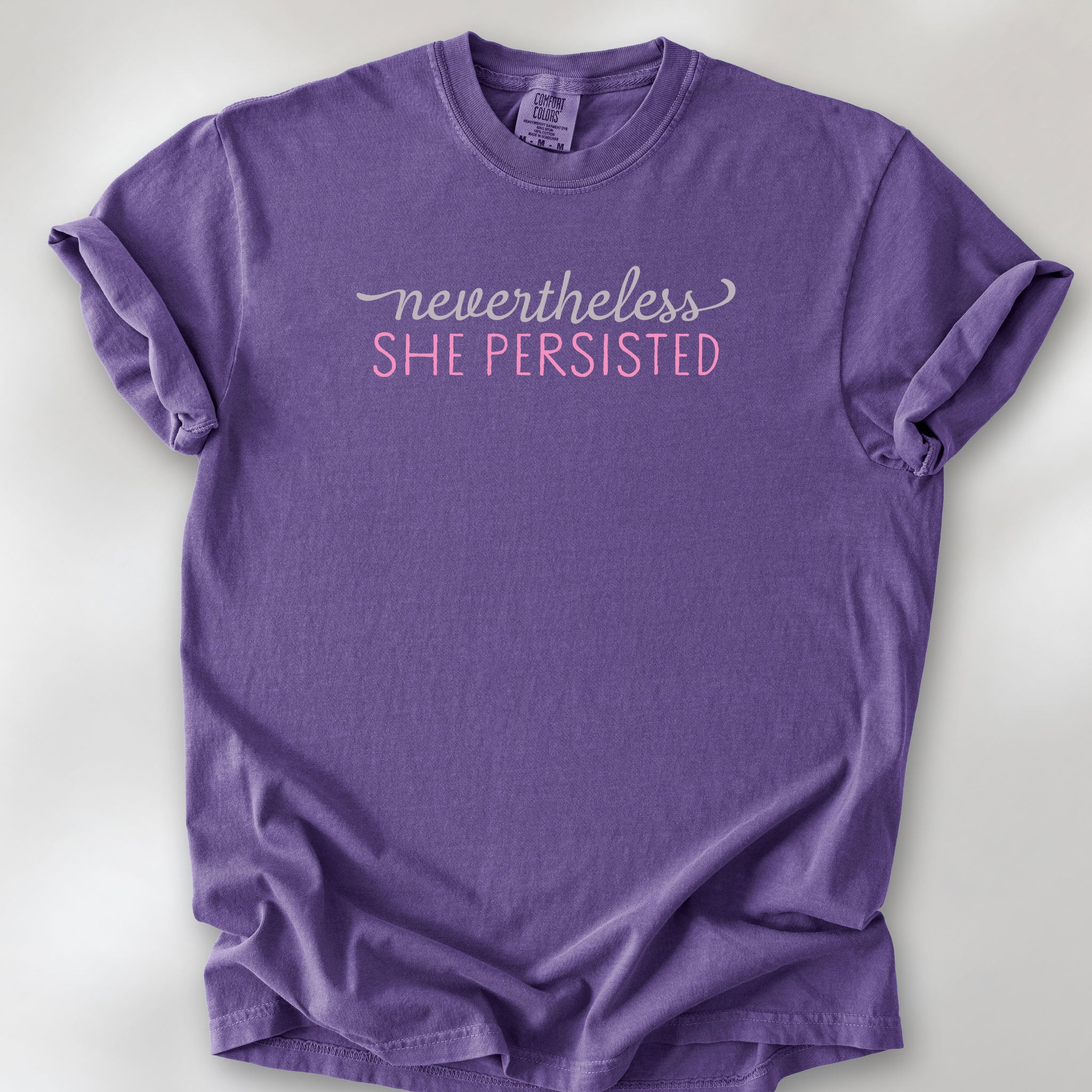 Grape t-shirt with stylized text that reads "nevertheless she persisted."