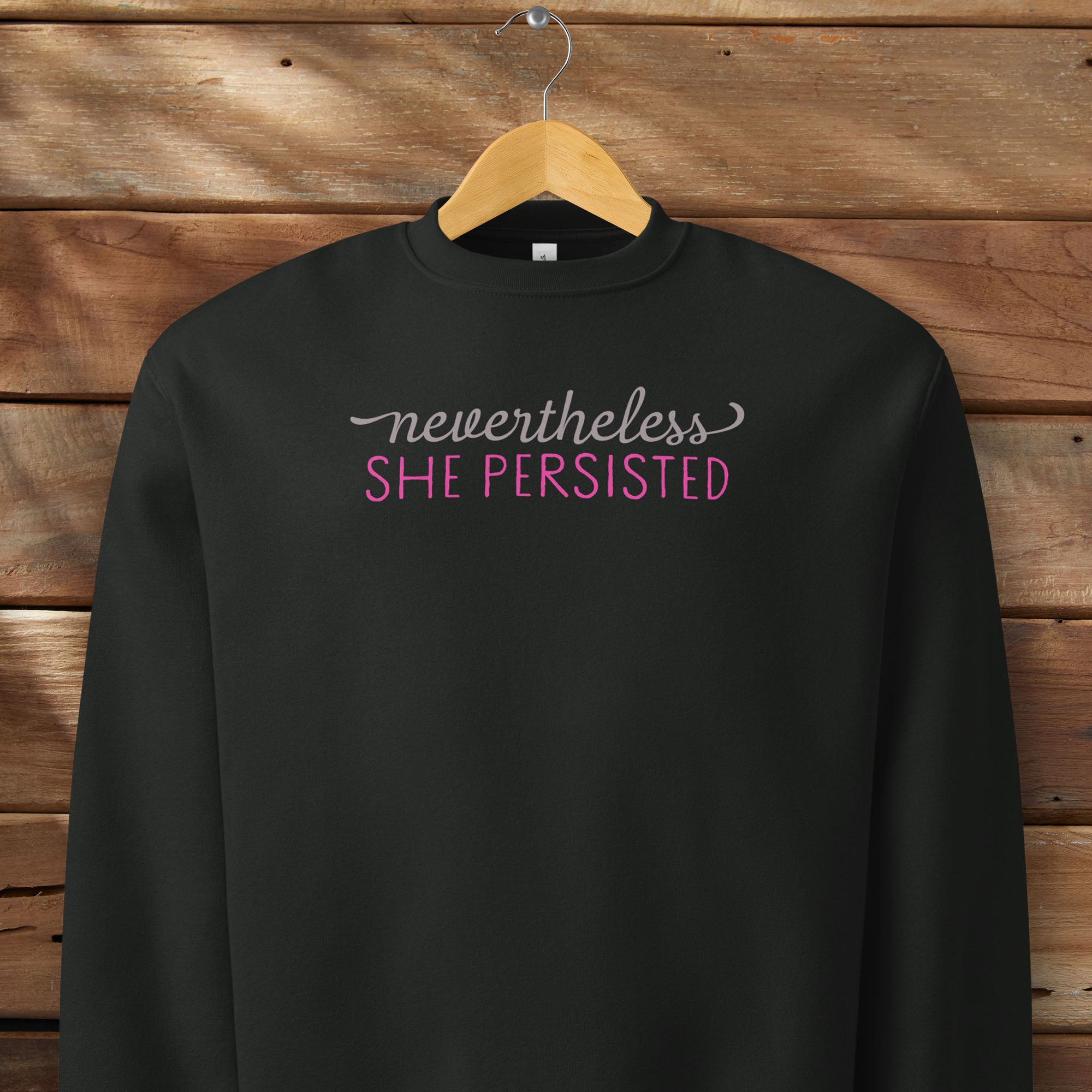 Black sweatshirt with styled text that reads 
