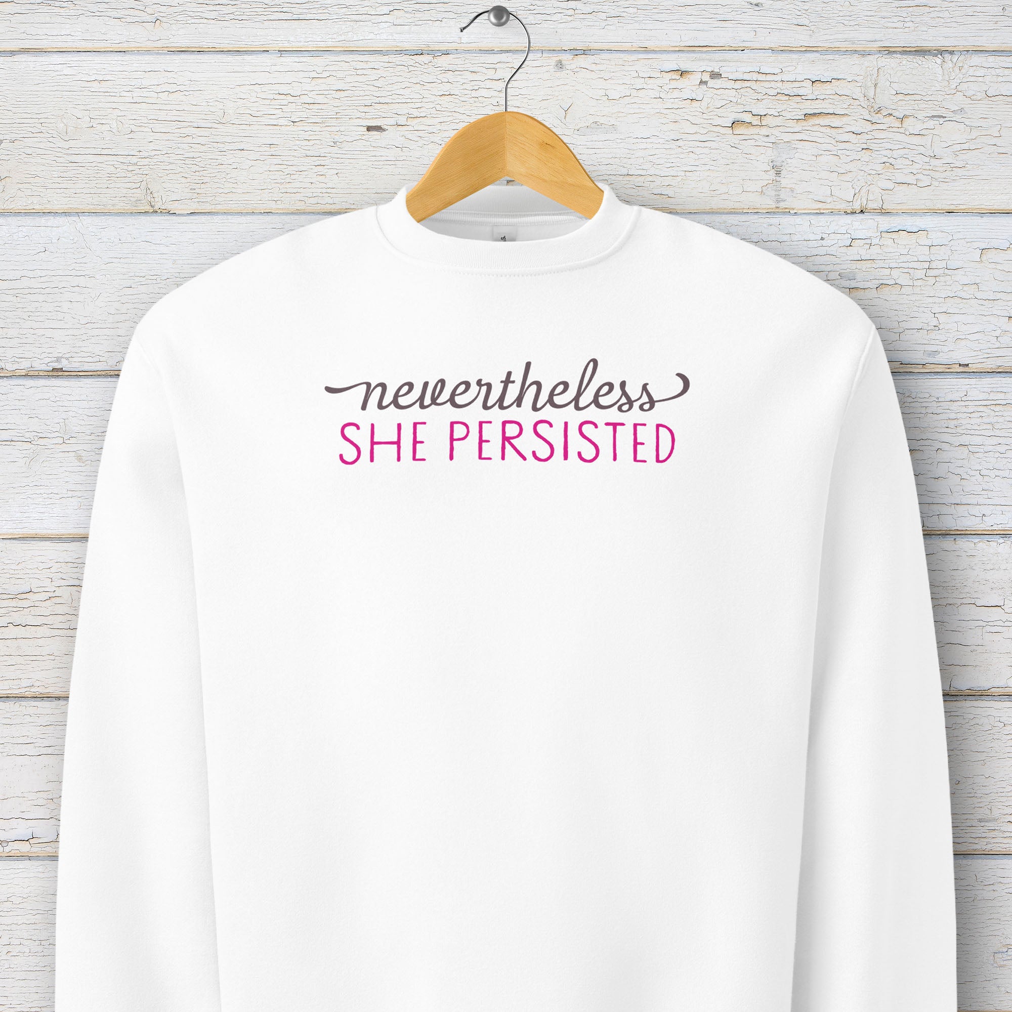 White sweatshirt with styled text that reads 