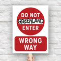 Protest sign reading “Do Not Enter Greenland” in bold text like a traffic sign, criticizing Trump’s foreign policy threats and U.S. imperialism.