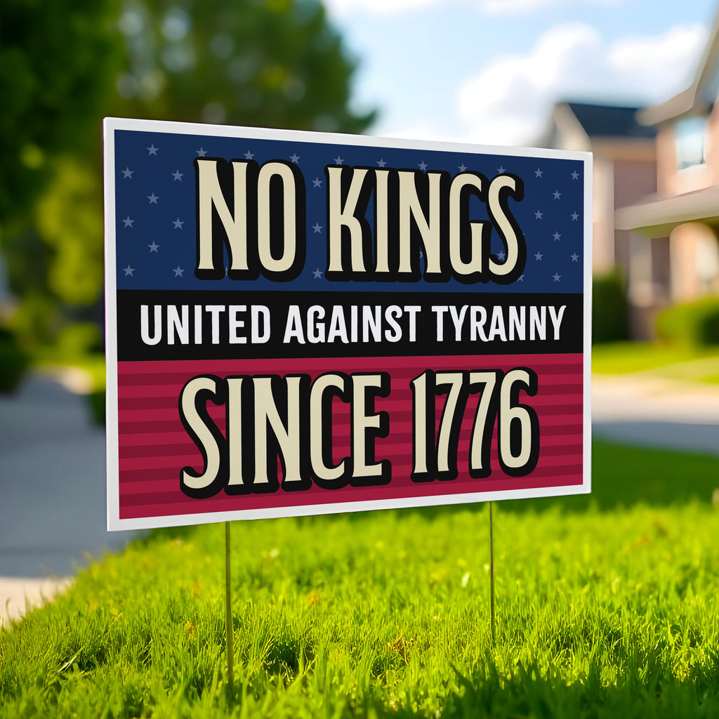 Yard sign in a lawn with blue and red stars and stripes background and gold and white text reading "No Kings – United Against Tyranny – Since 1776" – a defiant, anti-Trump message rejecting authoritarianism and honoring America's revolutionary roots.