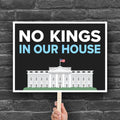 Protest sign reading “No Kings in Our House” with the White House illustration, used at anti-Trump rallies and No Kings Day marches.