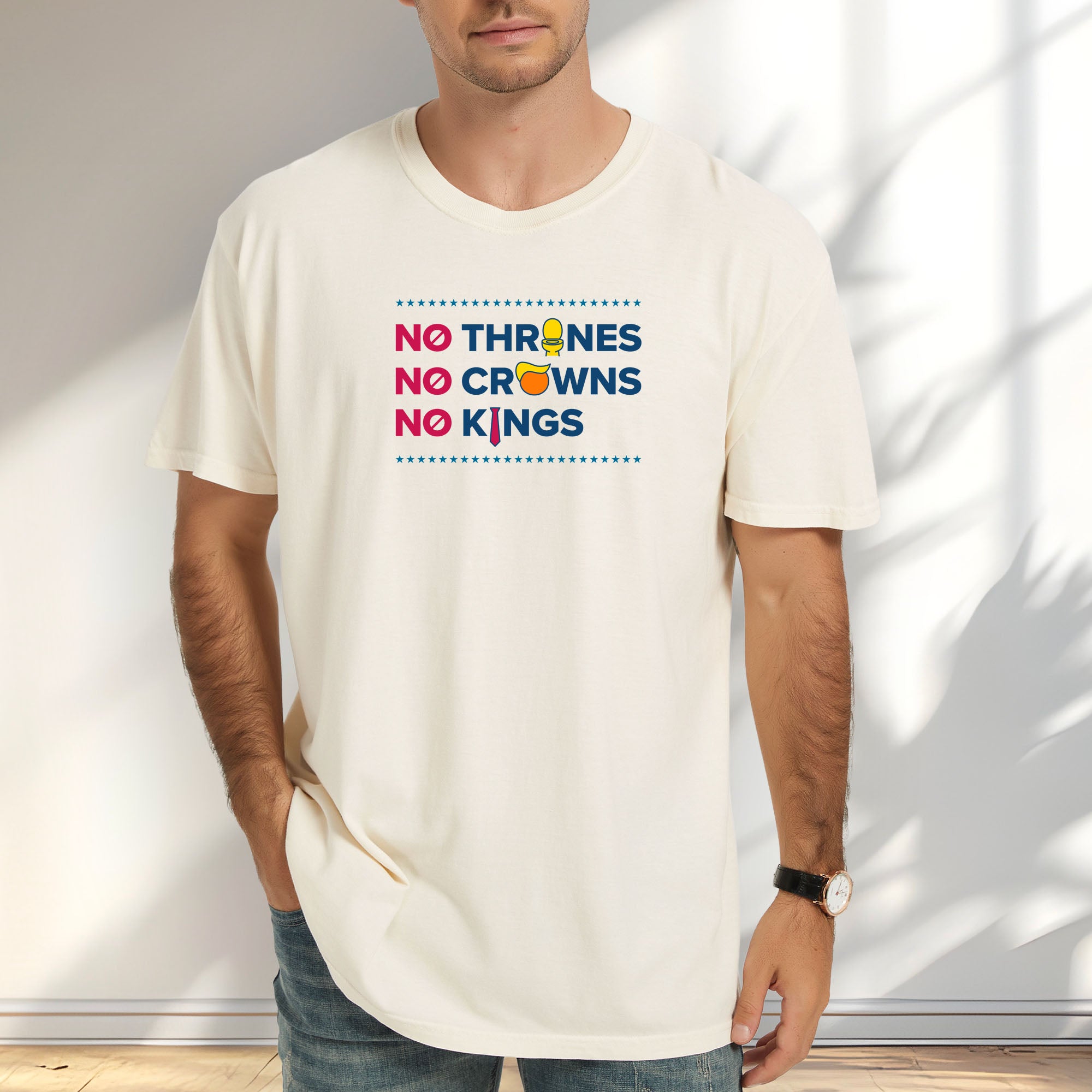 Male model wearing ivory t-shirt with bold text reading “No Thrones No Crowns No Kings” featuring satirical Trump graphics: gold toilet, yellow hair, and long red tie, original anti-Trump protest shirt.