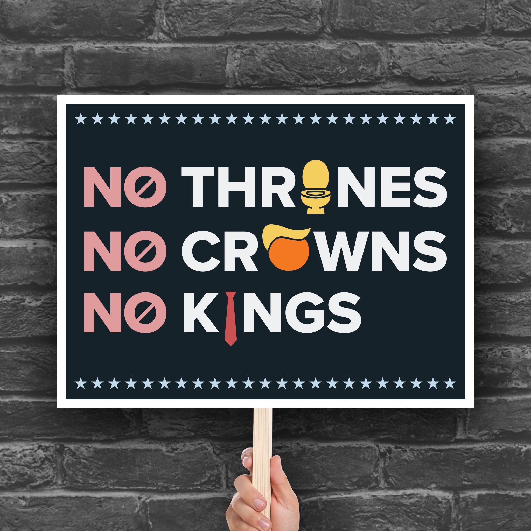 Protest sign reading "no thrones, no crowns, no kings" with the O in "thrones" as a gold toilet, the O in "crowns" as an orange face with yellow Trump hair, and the I in "kings" as a long red tie—visual satire mocking Trump’s authoritarianism and inflated ego.