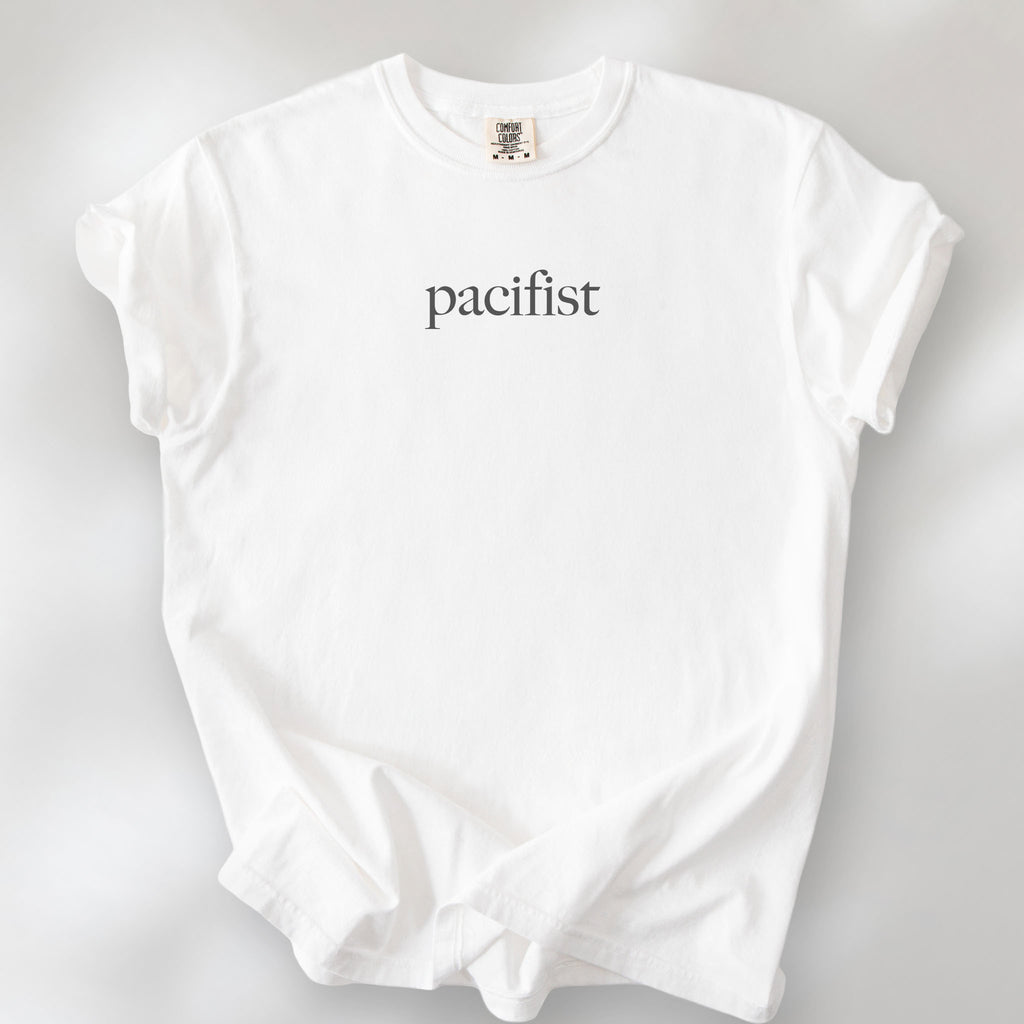 White t-shirt with minimalist serif text reading "pacifist."