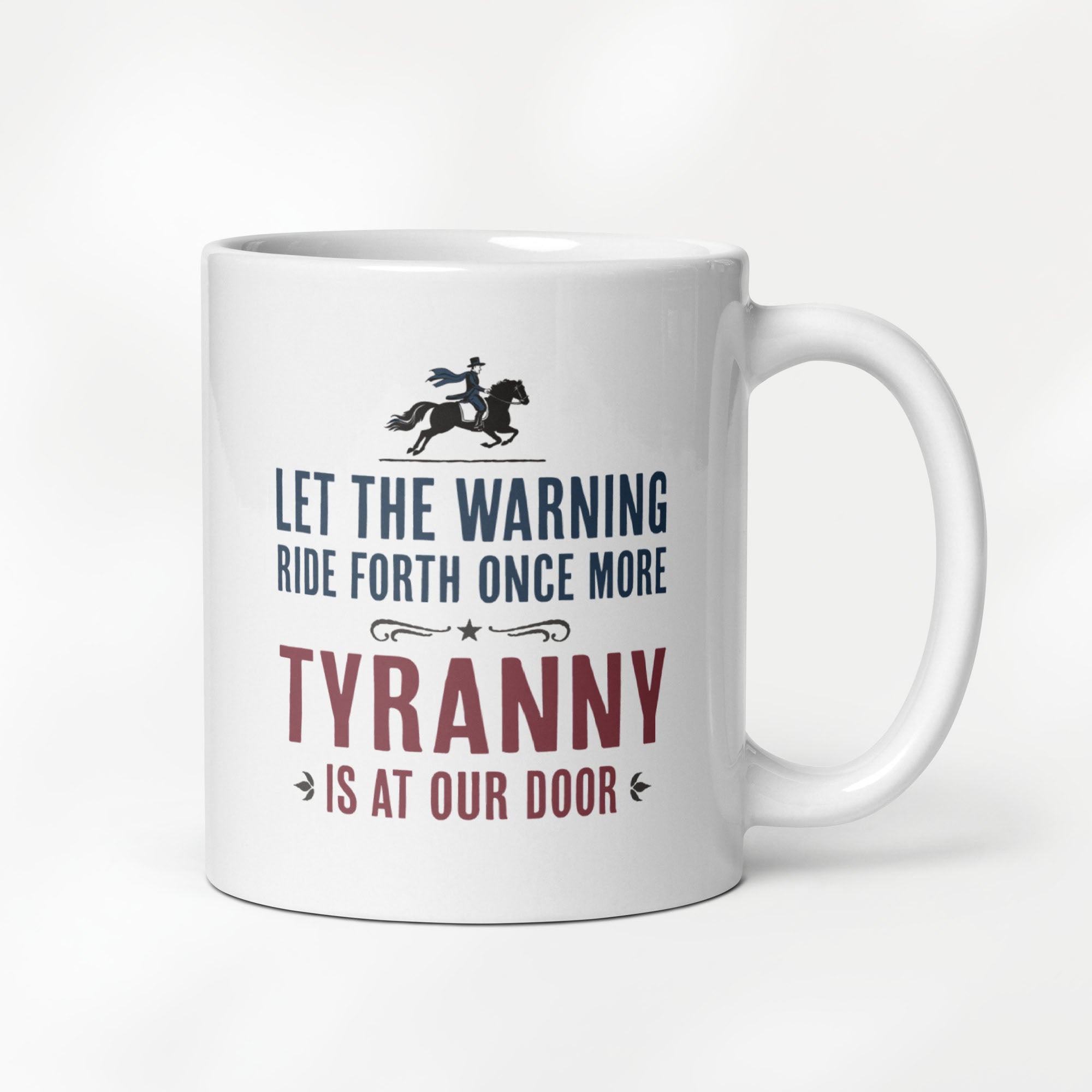 11 ounce white ceramic coffee mug with a historical-style design reading “Let the warning ride forth once more — Tyranny is at our door."