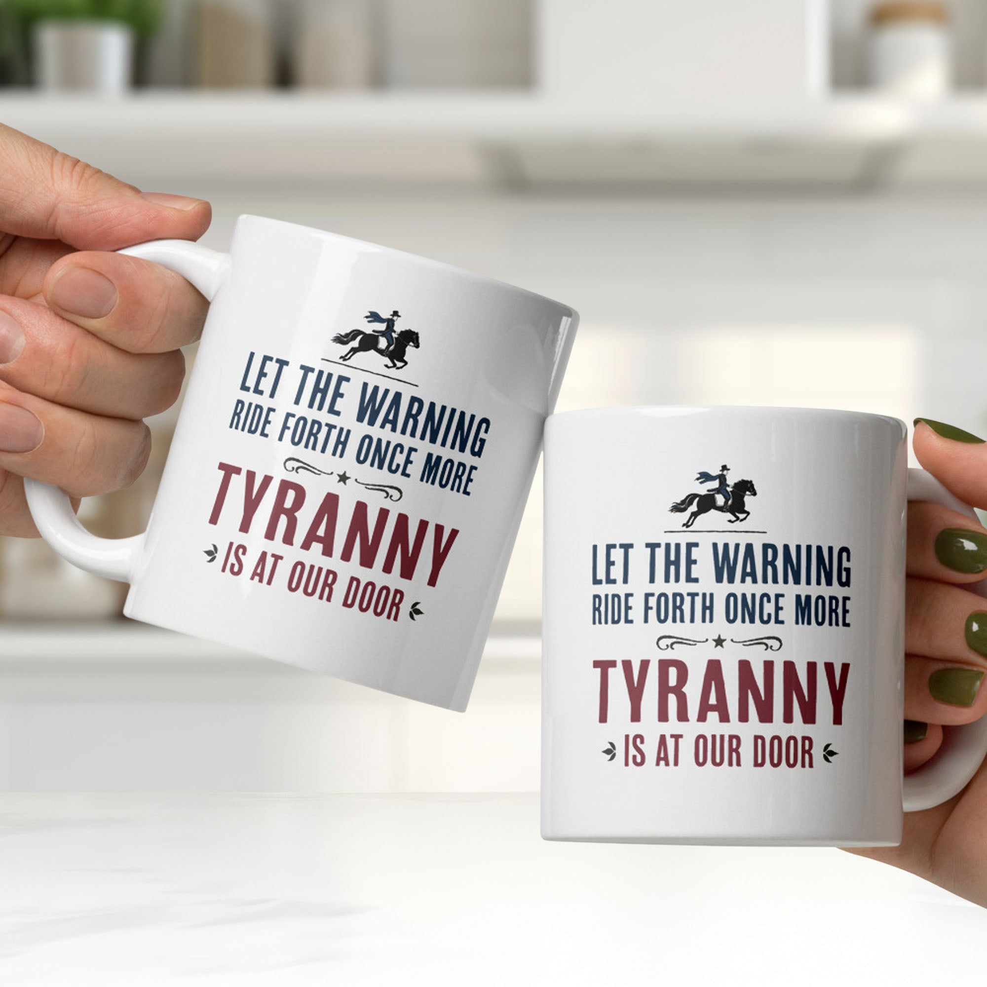Two people holding white ceramic coffee mugs with a historical-style design reading “Let the warning ride forth once more — Tyranny is at our door,” clinking them together in a bright kitchen.