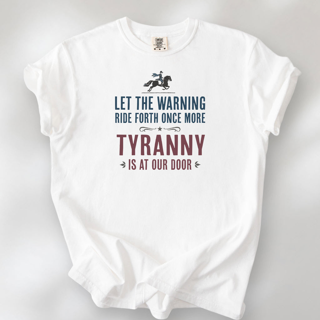 White t-shirt with a silhouette of Paul Revere on horseback and the text “Let the warning ride forth once more – Tyranny is at our door” in blue and red.