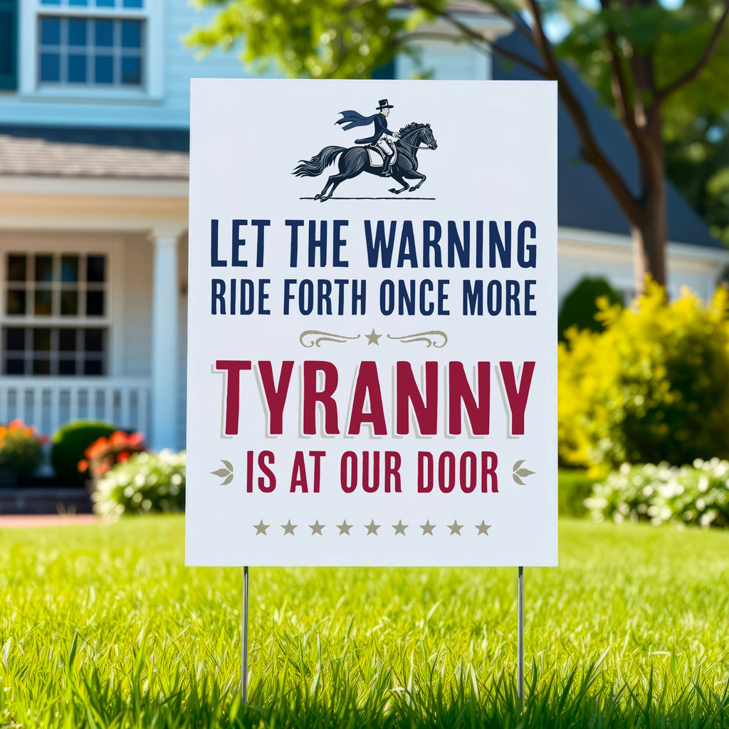 Yard sign in green lawn with text "Let the warning ride forth once more, Tyranny is at our door" and illustration of Paul Revere on a horse.