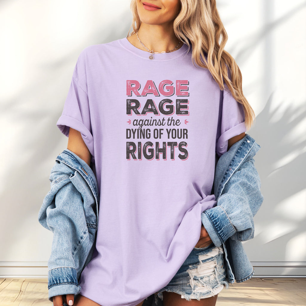 Female model wearing oversized orchid t-shirt with distressed bold text that reads "rage rage against the dying of your rights".
