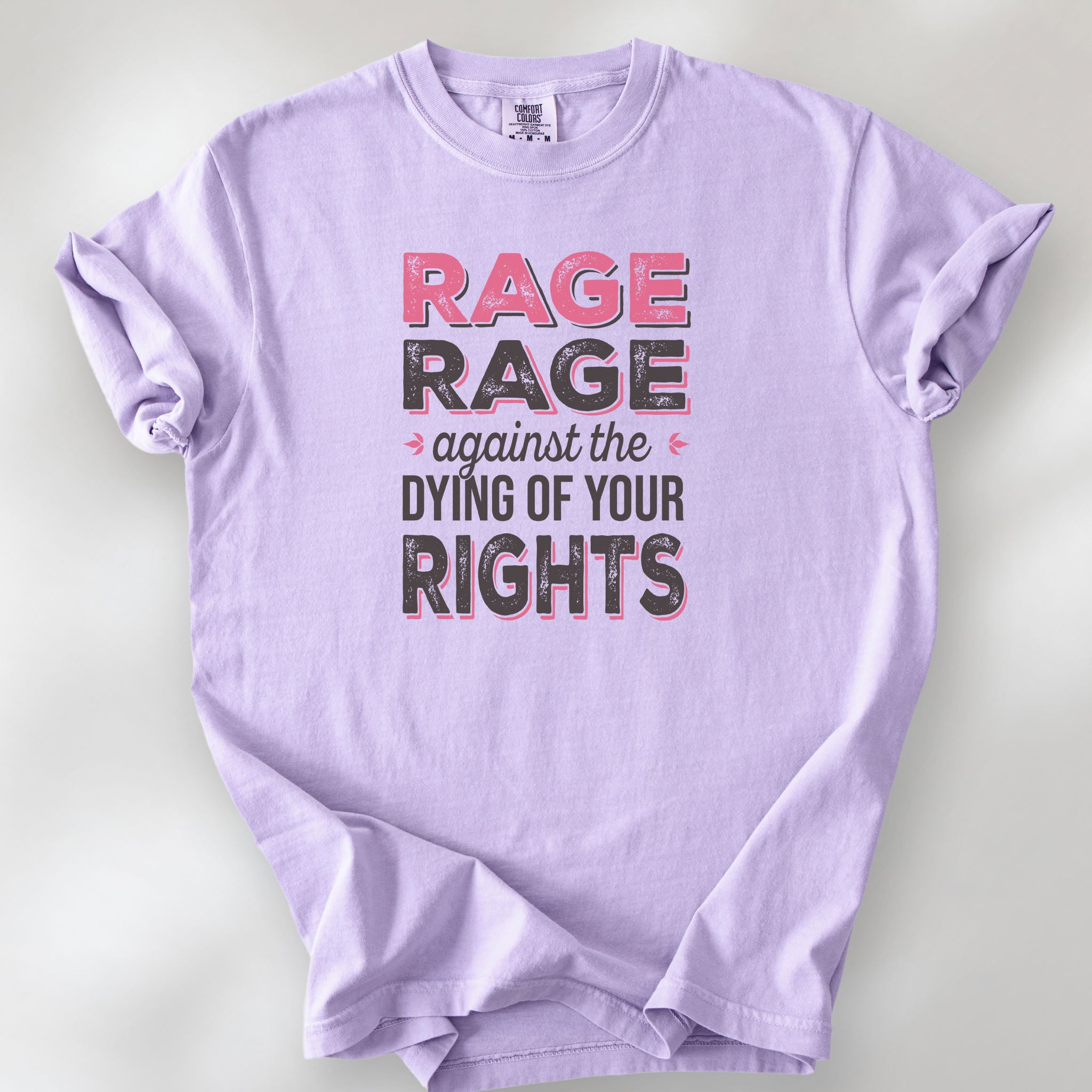 Orchid t-shirt with distressed bold text that reads "rage rage against the dying of your rights".