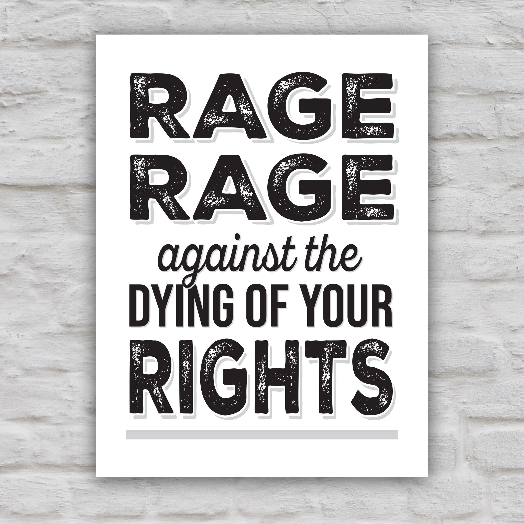 Black and white version of protest sign with bold distressed text that reads "Rage rage against the dying of your rights," a political twist to the line from a Dylan Thomas poem.