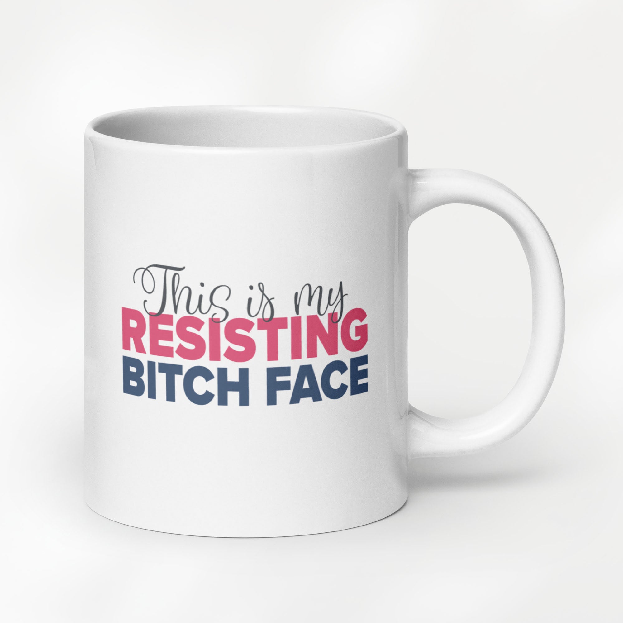 20 ounce white ceramic mug with a graphic that reads "This is my resisting bitch face" in stylized text.