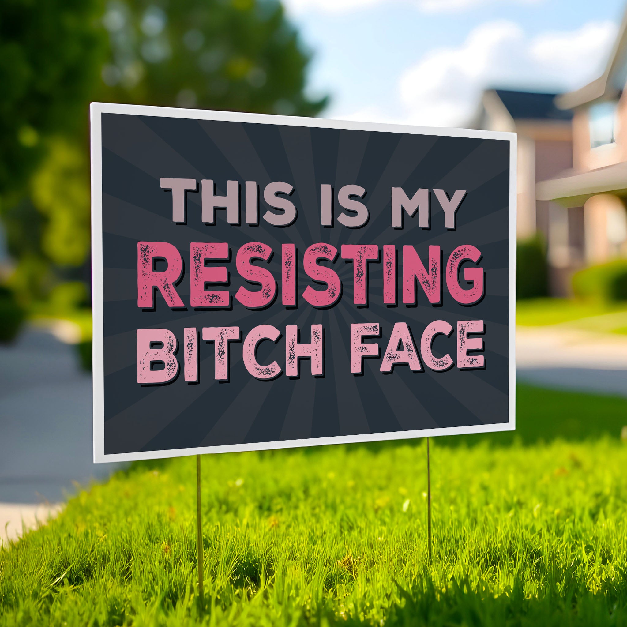 Yard sign with a black background and pink distressed text that reads "This is my resisting bitch face" in all uppercase letters.