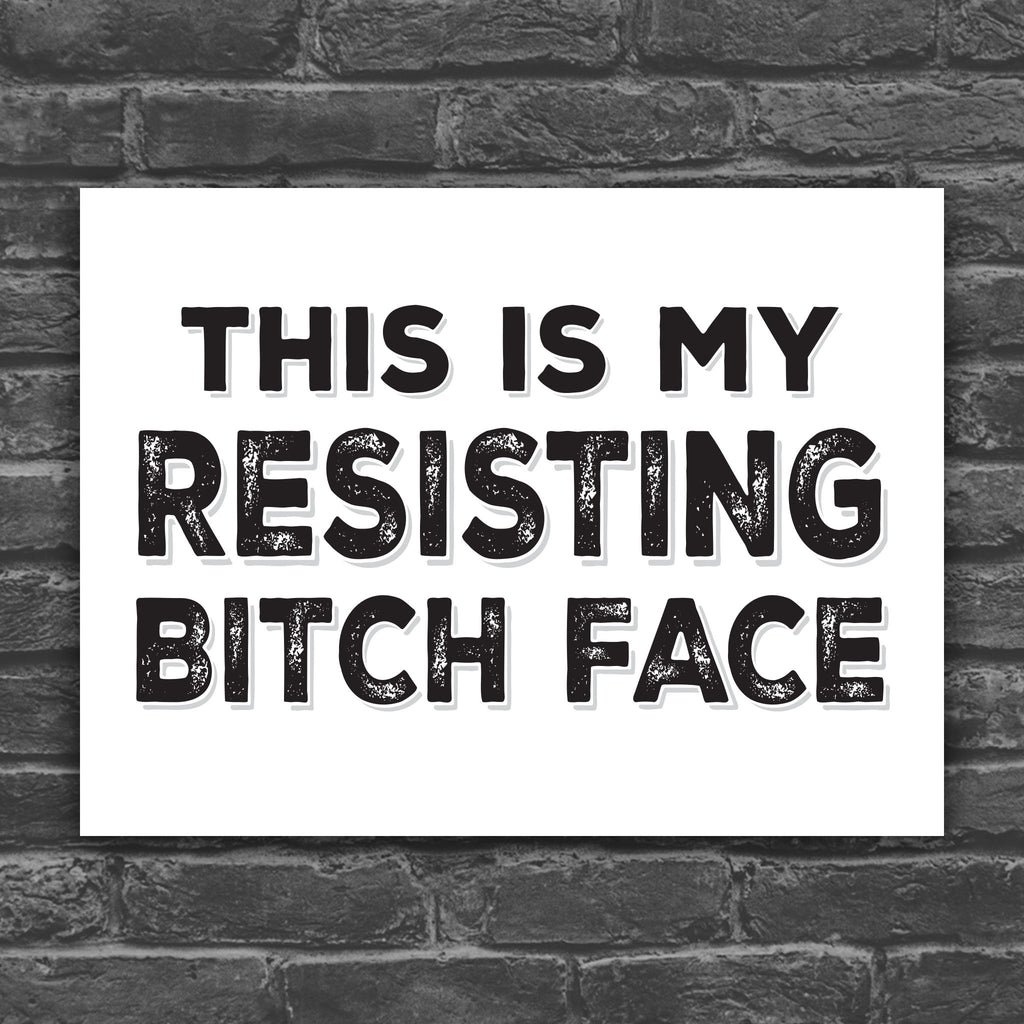Black and white version of protest sign with distressed text that reads "This is my resisting bitch face" in all uppercase letters.