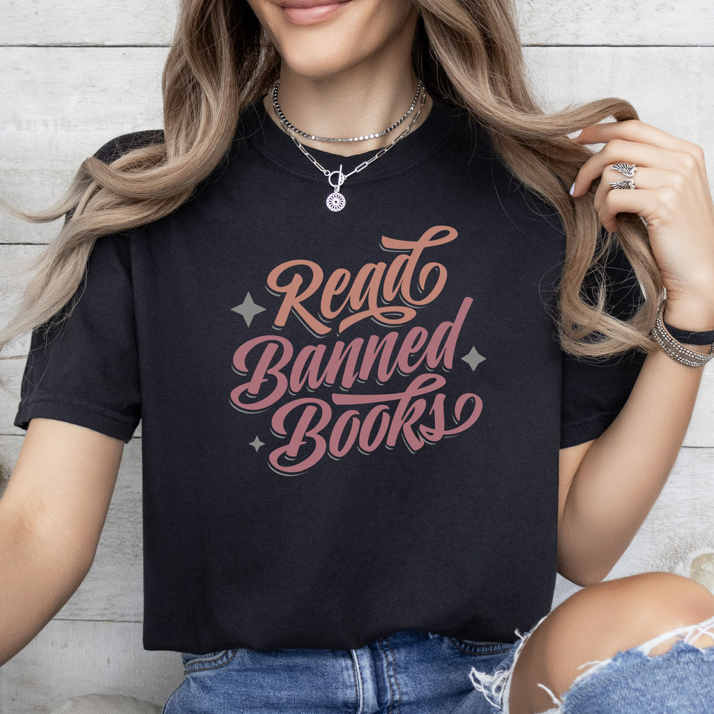 Female model wearing black t-shirt with stylized text reading “Read Banned Books” in bold script lettering.