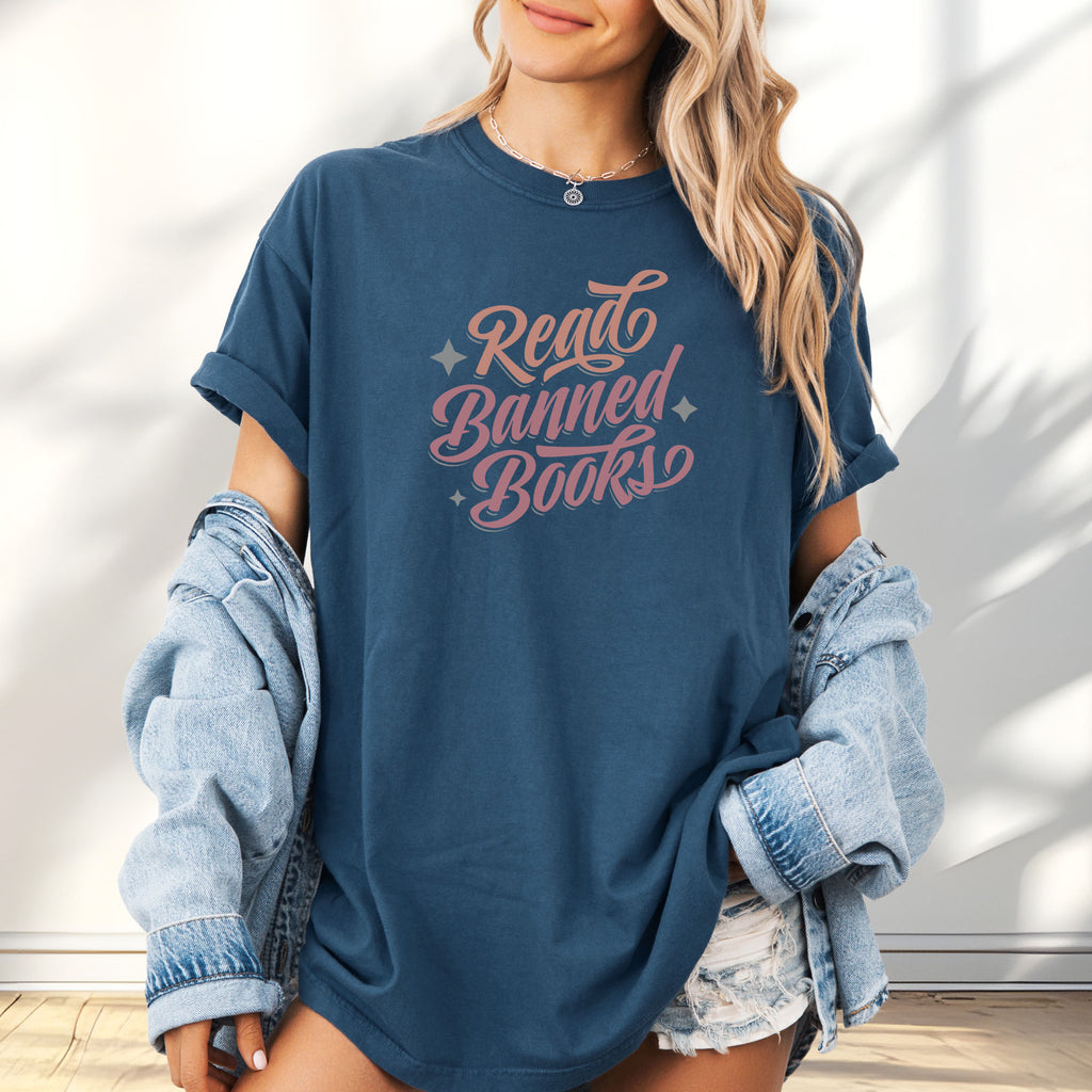 Female model wearing oversized midnight t-shirt with stylized text reading “Read Banned Books” in bold script lettering.