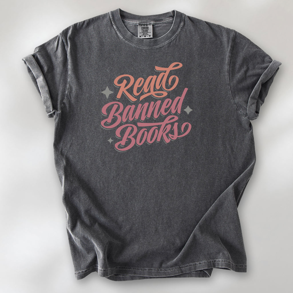 Pepper t-shirt with stylized text reading “Read Banned Books” in bold script lettering.